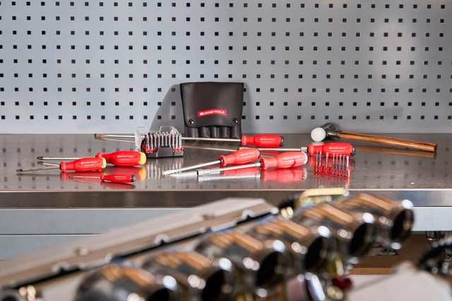 Hand tools arranged on a workbench