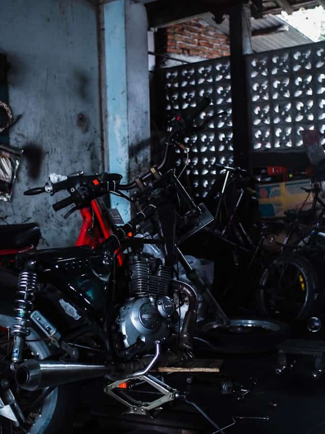 Motorcycles and engine parts in a workshop