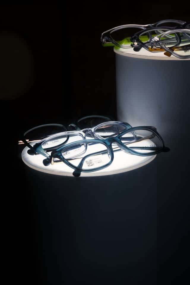 Eyeglasses arranged on display stands