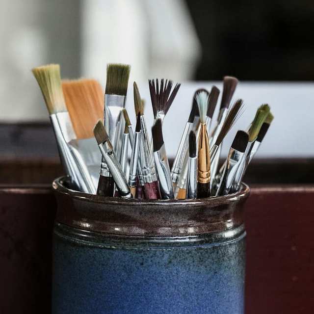 Paint brushes arranged in a container