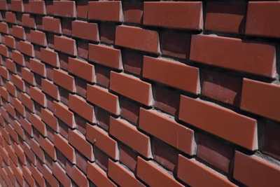 Red brick wall with fresh mortar joints