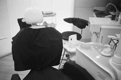 Dental treatment room with chair and clinical equipment