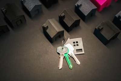 House models and keys arranged on a property display