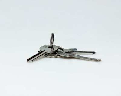 Set of house keys on a clean light surface