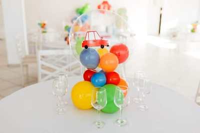Colourful balloons and party decorations arranged in a bright room