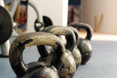 Kettlebells arranged on a training floor