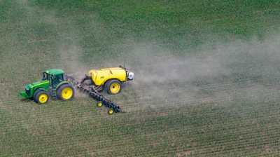 Agricultural sprayer equipment applying treatment across a field