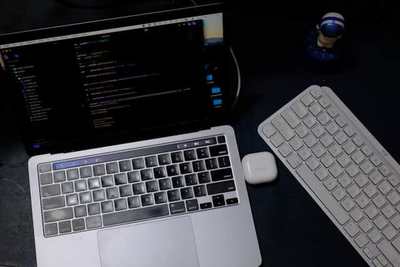 Laptop and keyboard on a desk